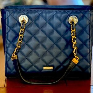 Navy quilted vegan leather bag.